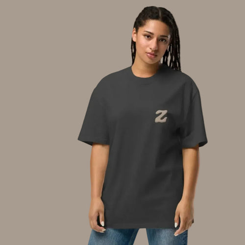 Model wearing dark grey Zenvyra Ambient Tee with an oversized heavyweight fit