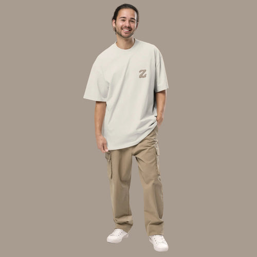 Model wearing light beige Zenvyra Ambient Tee with an oversized relaxed fit